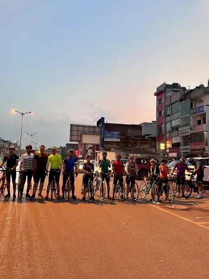 The team lines up for an early morning photo before the city wakes up.