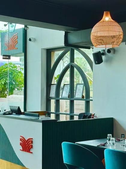 The reception desk, where your experience begins. The design incorporates our signature arches and patterned details, setting the tone for the authentic and stylish meal ahead.