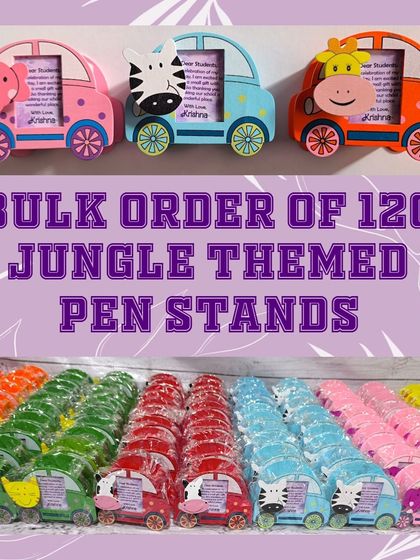 A bulk order of 120 jungle-themed pen stands, showcasing the variety of animal designs and colors available. These are great for school events or large parties.