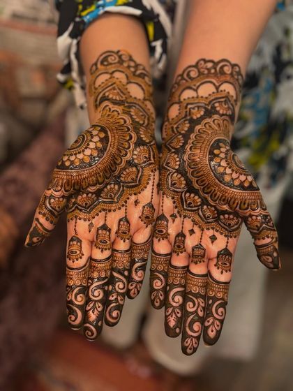 A close up of the "jhumka" design, showing the intricate details and the rich color of the henna.