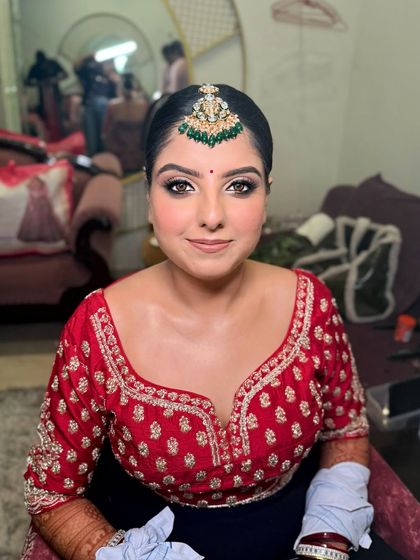 Drishti looking confident and beautiful. The complete look, from the maang tikka to the lip color, is harmonized for a perfect bridal aesthetic.