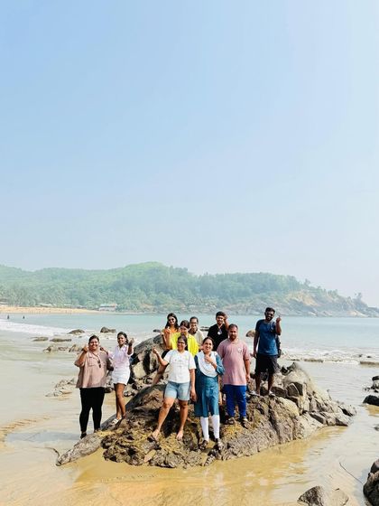 Posing on the rocks at Kudle Beach in Gokarna, a popular spot for our groups.
