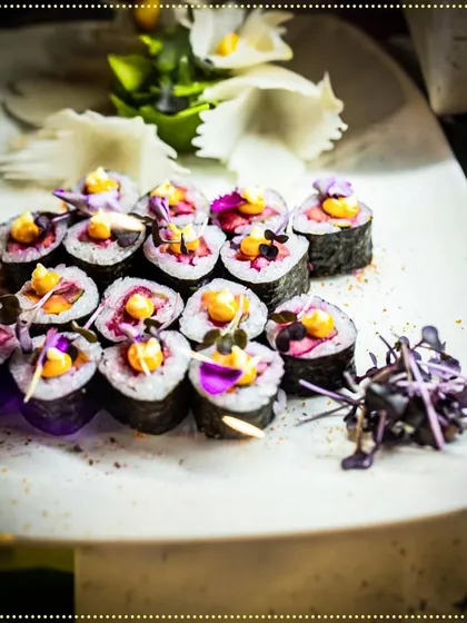 Our chefs prepared a variety of world cuisines for this intimate wedding. These beautiful sushi rolls, garnished with edible flowers, were a highlight of the Asian station.