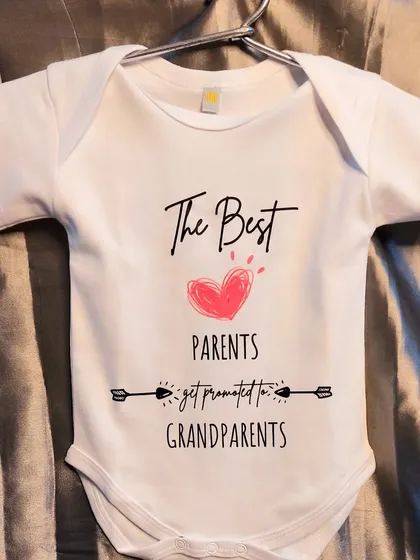 "The Best Parents Get Promoted to Grandparents." This custom baby romper is such a heartwarming way to announce a new arrival to the family.