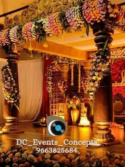 A close-up view of the traditional wedding stage, focusing on the intricate floral work and the ornate pillars. This type of decor is perfect for celebrating cultural heritage with grandeur.