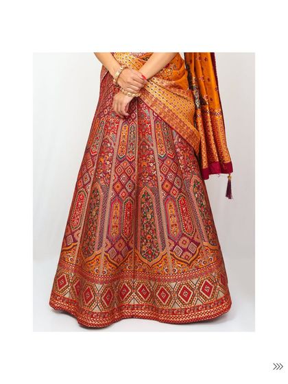 Embrace traditional craftsmanship with this stunning brocade lehenga. The rich fabric and vibrant colors make it a perfect rental for attending a winter wedding or a festive puja.