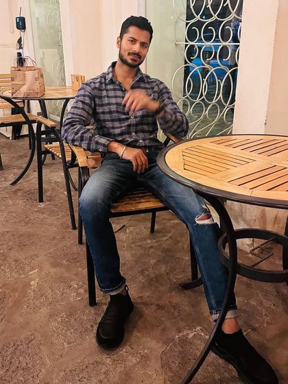 A relaxed moment at a cafe, showing my everyday, off-duty style.