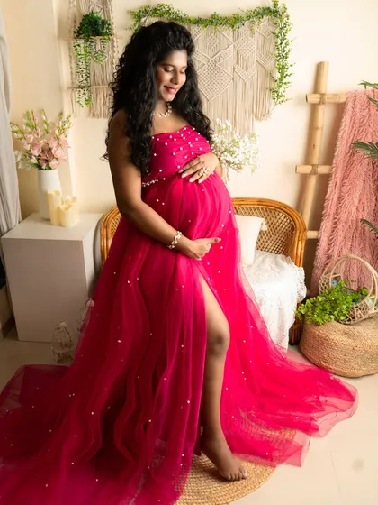 My studio includes various setups, like this boho-chic corner with natural textures. I pair it with gowns from my collection, like this pearl-studded pink tulle dress, to match the vibe you're looking for.