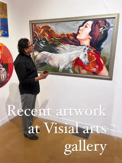 A visitor at the Visual Arts Gallery contemplating my painting of a woman and a white horse. This piece explores themes of passion, freedom, and the wild spirit within.