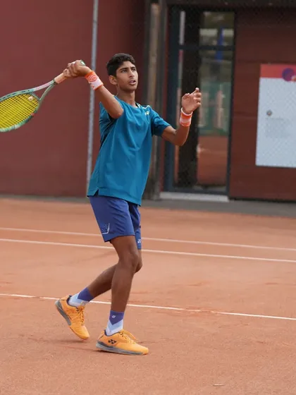 A shot of Tavish Pahwa's service motion during a tournament in Europe. We work meticulously on the biomechanics of every stroke to maximize power and efficiency.