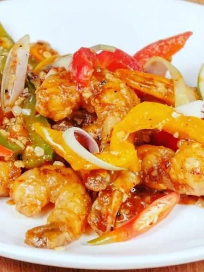 Fresh prawns stir-fried with colourful bell peppers, onions, and a hint of lime. This is a light yet flavourful seafood dish that works as both a starter and a side.
