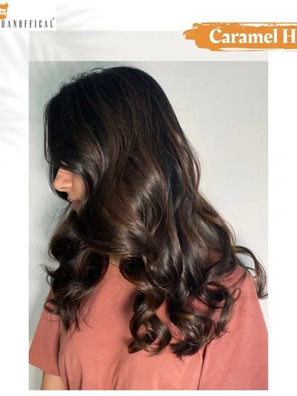 A soft caramel shade adds a nice contrast to this super sleek, super shiny new hair color.