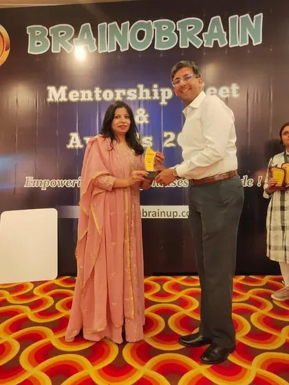 A proud moment receiving an award at the Mentorship Meet and Awards Ceremony. I am grateful for the recognition of our hard work and sincere involvement with the children.