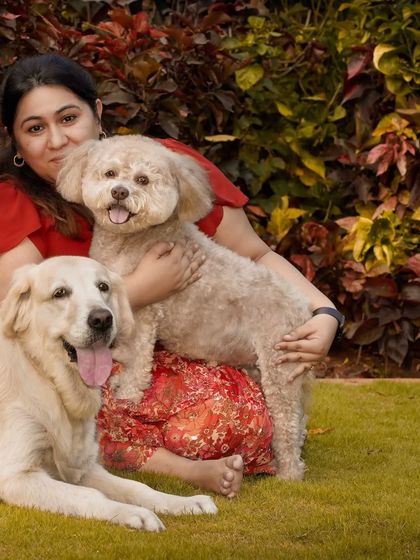 Focusing on the woman and her two dogs, this shot highlights her connection with both of them.