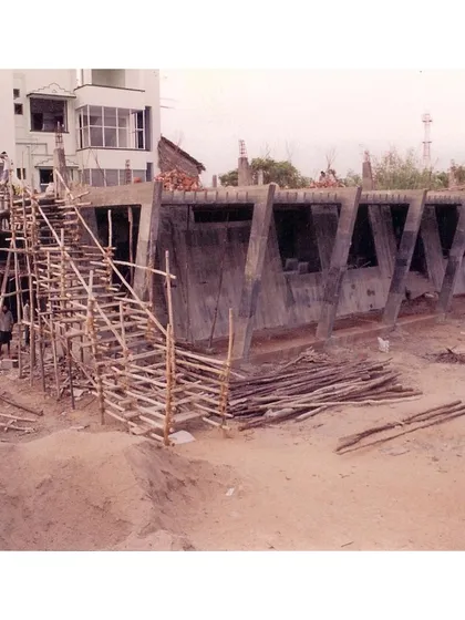 A photograph from the construction phase of the CC Office, circa 2002. This shows the self-stable tapered concrete form taking shape, a testament to our technical execution.