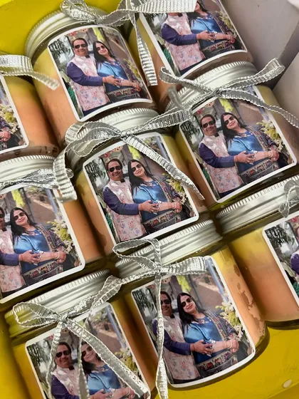 Celebrate a milestone anniversary with these special photo candles. We used a lovely picture of the couple for their silver jubilee return gifts.
