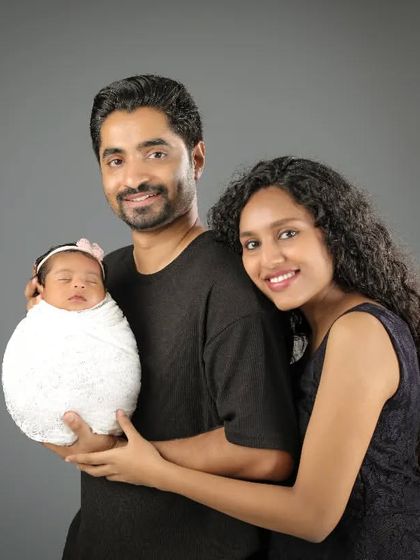 A beautiful first family portrait. The way they gaze at their new baby, and each other, is filled with so much love and wonder.