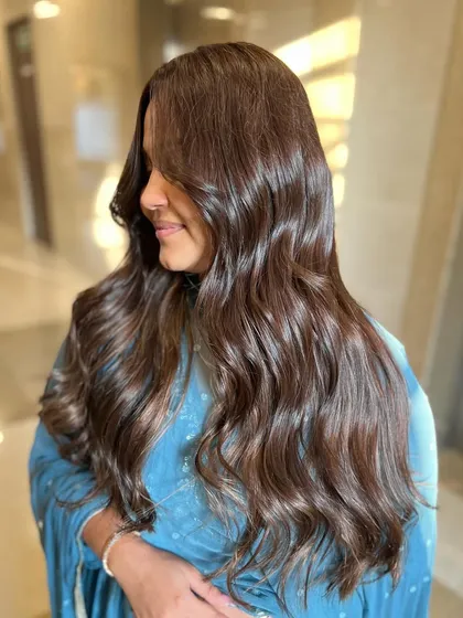A side view of the Gold Browns look, showing how the color and style beautifully frame the face.