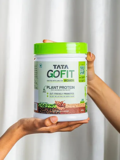 Another take on the hands-holding-product shot, this time against a white curtain for a softer, more lifestyle-oriented feel.
