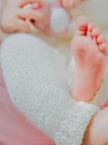 A close-up of tiny newborn feet. These are the details that change so quickly, and the ones you'll love looking back on.