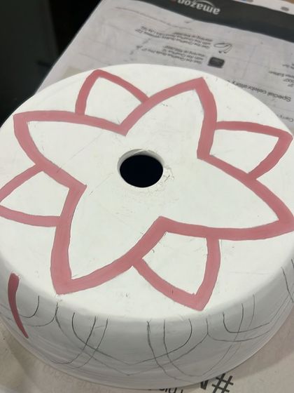 The first layer of color is applied to the lampshade design. This step starts to bring the pattern to life.