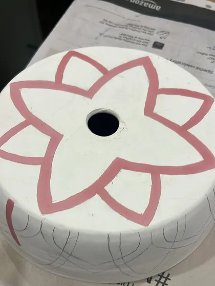 The first layer of color is applied to the lampshade design. This step starts to bring the pattern to life.