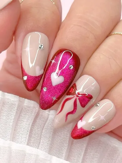 A beautiful Valentine's Day design. This set features a shimmery red cat-eye base with heart and bow details, all accented with sparkling rhinestones.