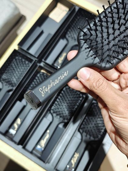 A look at the GHD hairbrushes, each with a name elegantly written in gold. These were prepared as gifts for guests at the Aveda Salon event.