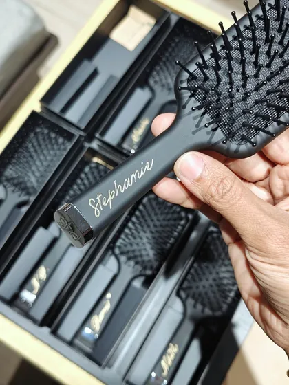A glimpse from a live personalization event for GHD hairbrushes at Aveda Salon. Each brush was customized with a name in elegant gold script, like this one for 'Stephanie'.