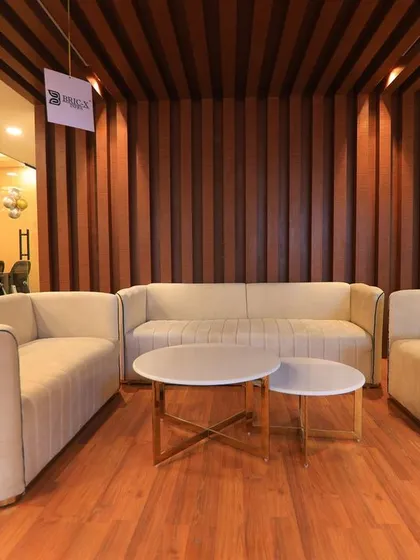 The waiting lounge of a corporate office, photographed to show a welcoming and professional space for visitors. These images help build a company's brand image.