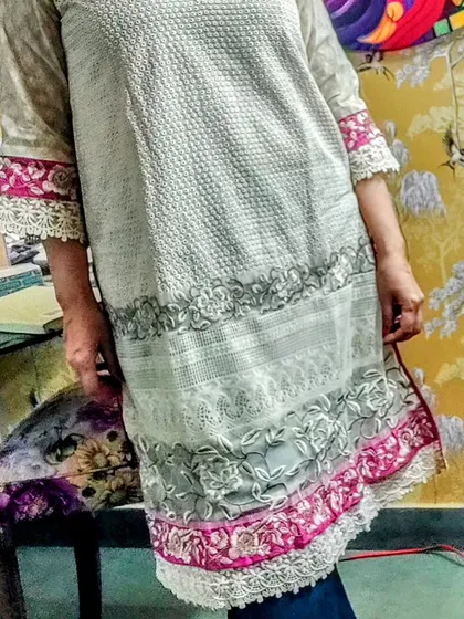 A full view of a beautiful Hakoba kurta with embroidered and lace-trimmed borders. This piece is perfect for summer, offering a breathable fabric with elegant detailing.