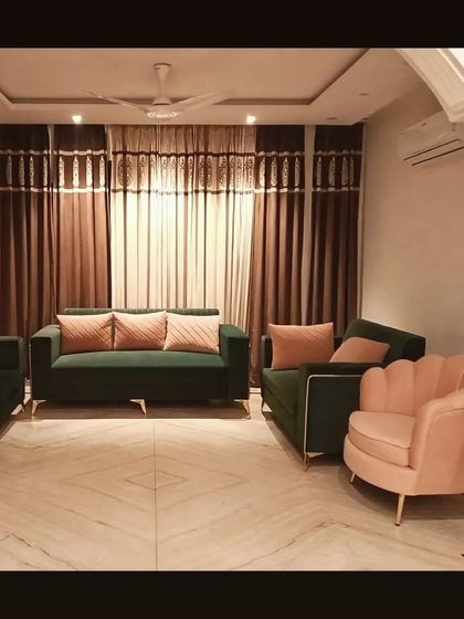 A budget-friendly yet stylish pre-wedding renovation, this living room uses a combination of emerald green and blush pink furniture to create a trendy and welcoming space.