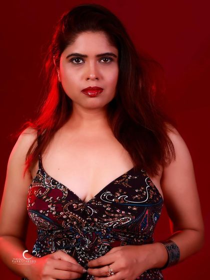 A direct and powerful portrait. Her gaze is confident, and the simple styling keeps the focus on her.