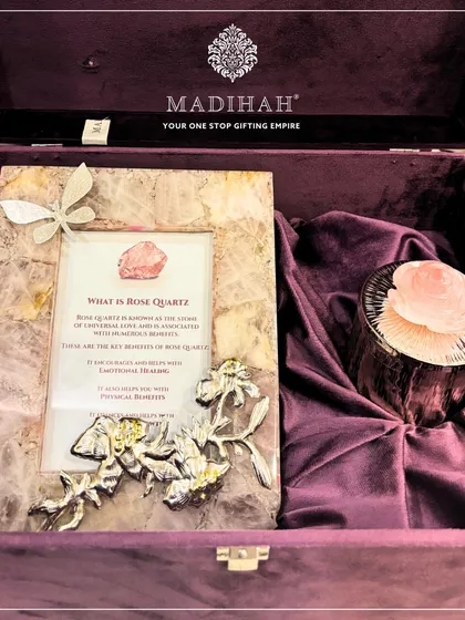 A closer look at the Rose Quartz Aura Hamper. The natural patterns of the stone make each photo frame unique, and the silver-sculpted floral details add a touch of our signature craftsmanship.