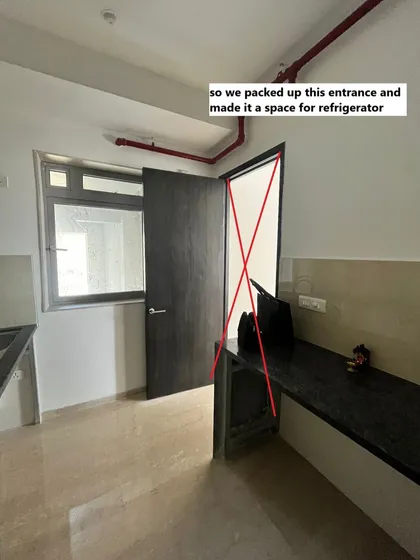 Sometimes, the best layout isn't the one the builder gives you. Here, we decided to pack up an unnecessary kitchen entrance to create a dedicated, clutter-free space for the refrigerator.