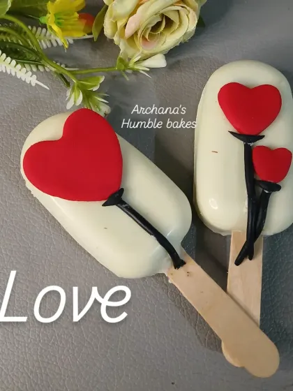 My heart-themed cakesicles are a cute and popular treat, especially for Valentine's Day or anniversaries. They are made of cake crumbs mixed with frosting, dipped in white chocolate, and decorated with love.