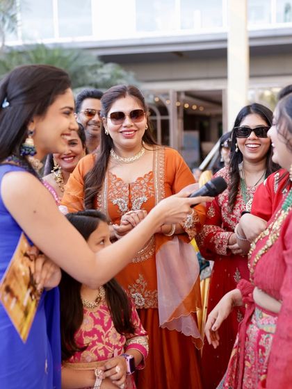 Engaging with the ladies of the family during a daytime function. It's all about those fun-filled conversations and shared laughter.