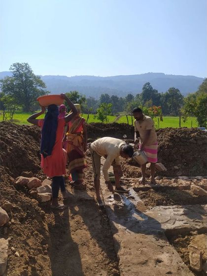 Local community members working together to lay the foundation for a homestay in Madhya Pradesh. Our process is participatory, involving local families and artisans from the very beginning to ensure the project generates employment and reflects their culture.
