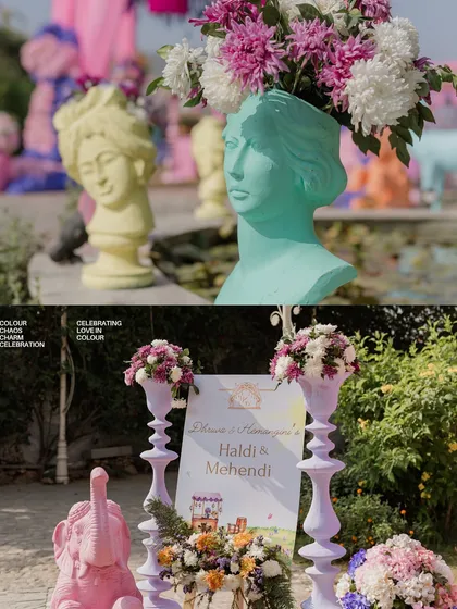 Details from a colorful Haldi and Mehendi, featuring pastel-painted statues as flower vases and a welcome sign flanked by matching decor elements.