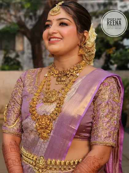 A radiant, sun-kissed shot of Nidhi. Her glowing skin and traditional attire look absolutely breathtaking in the natural light.