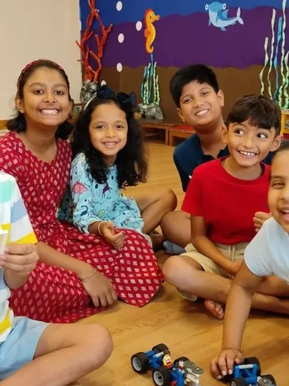 A happy group of creators after finishing their balloon car race project. My camps are a place where kids make new friends, collaborate on exciting STEM challenges, and build skills that last a lifetime.