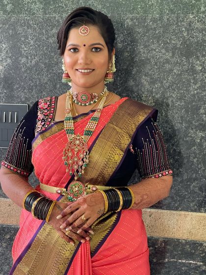 A smiling portrait showcasing her complete look. She looks confident and beautiful, ready for the ceremony.