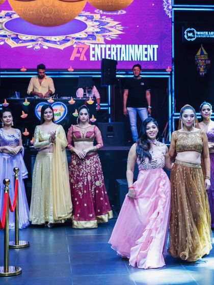 Models on the runway during our Diwali fashion event. I can curate a sophisticated and energetic soundtrack for fashion shows and corporate events.