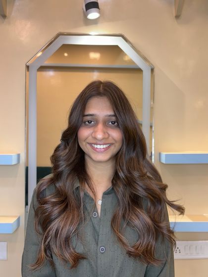 A light brown global base with beige blonde highlights. This combination creates a soft, dimensional look that is both beautiful and easy to maintain.