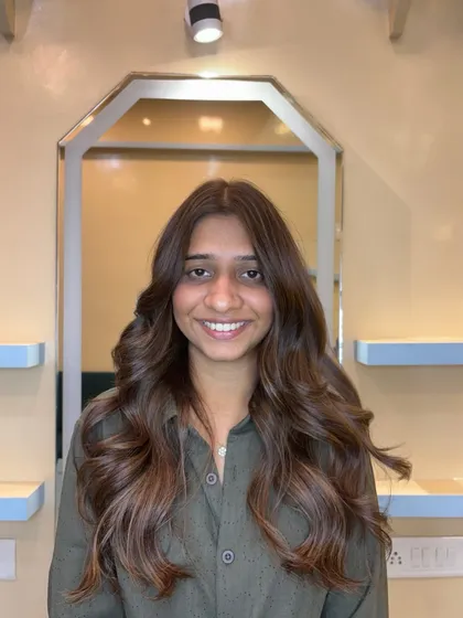 A light brown global color with beige blonde highlights. This is a great way to add dimension and brightness to your hair.