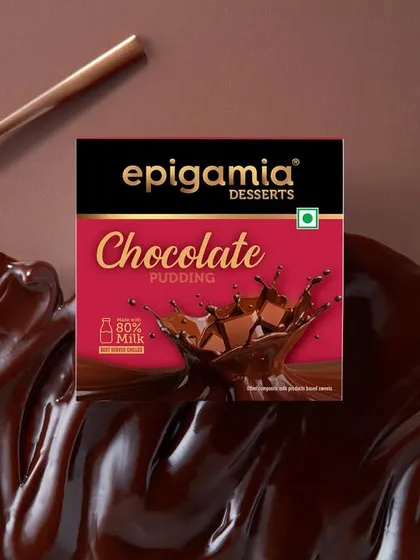 This creative shot for Epigamia's chocolate pudding places the product box on a bed of luscious, melted chocolate. The texture of the chocolate swirl was the main focus, creating a sensory experience that screams indulgence.