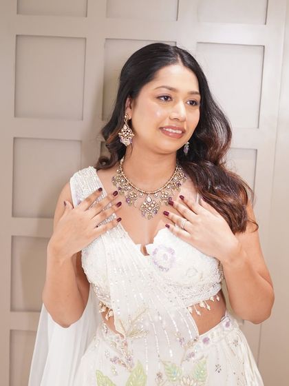 A close up of the bride, highlighting the subtle glam makeup that enhances her natural charm.