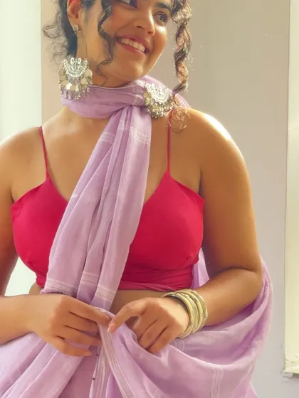 A close-up on the details. The silver jhumkas and the delicate fabric of the lilac saree are the stars here. I believe in investing in quality pieces, both in clothing and jewelry, that you can wear for years to come.
