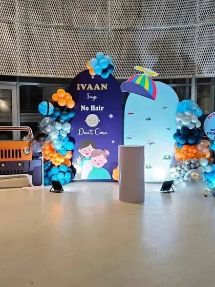 A unique 'No Hair Don't Care' mundan ceremony theme with a jeep cutout and custom backdrops.