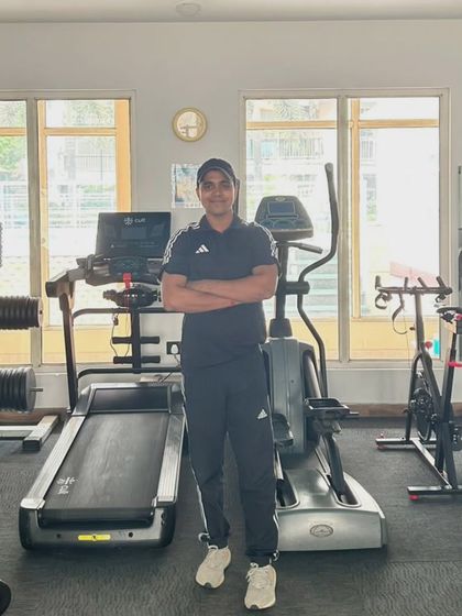 Standing in the gym in Noida Sector 45, surrounded by the tools we use to build stronger bodies.
